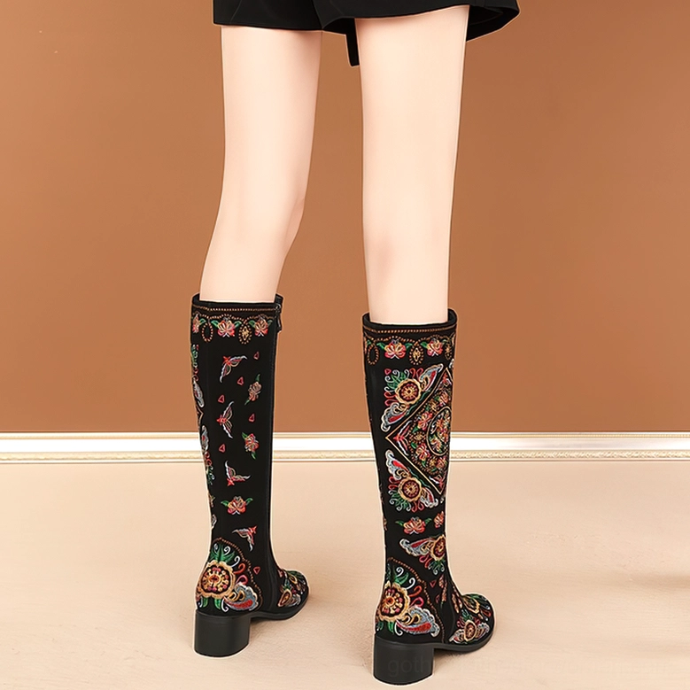 Gothic knee-high boots with embroidered detailing and polyurethane lining, premium suede material quality showcase