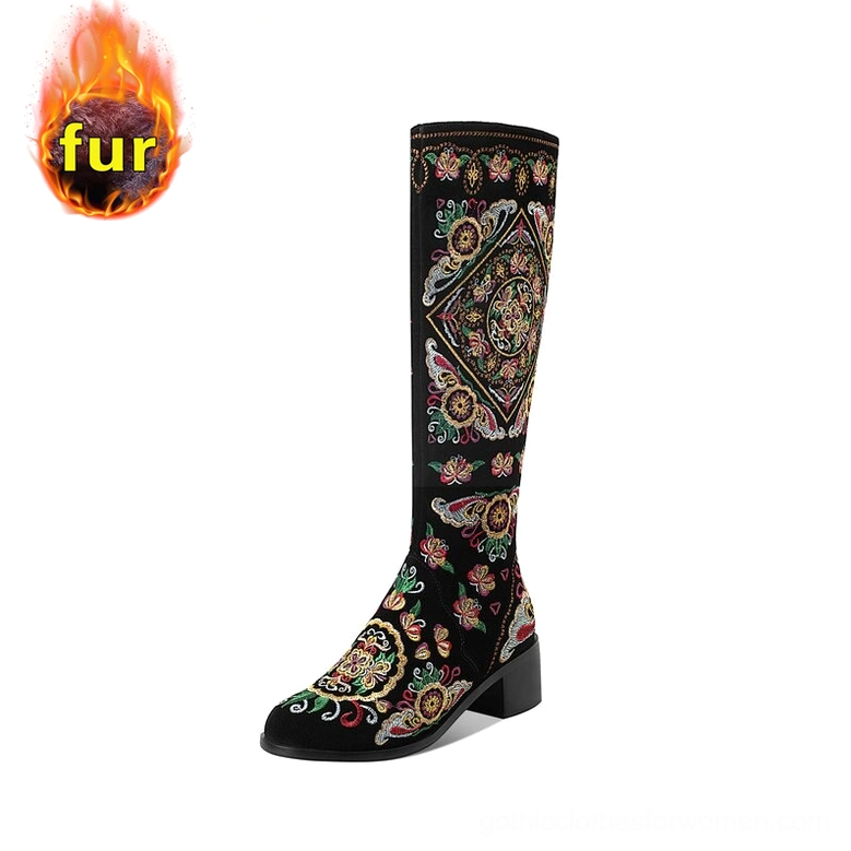 Black gothic knee-high boots with fur lining and hand-embroidered floral detailing, marked with fleece lining tag, right profile angle
