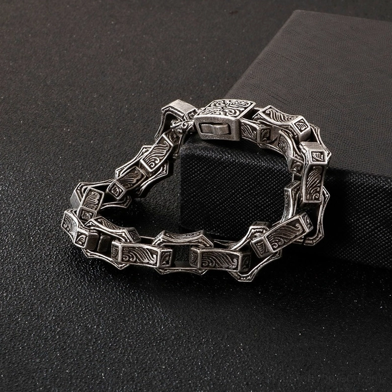 Vintage gothic engraved square link bracelet lifestyle shot on male wrist dark aesthetic styling