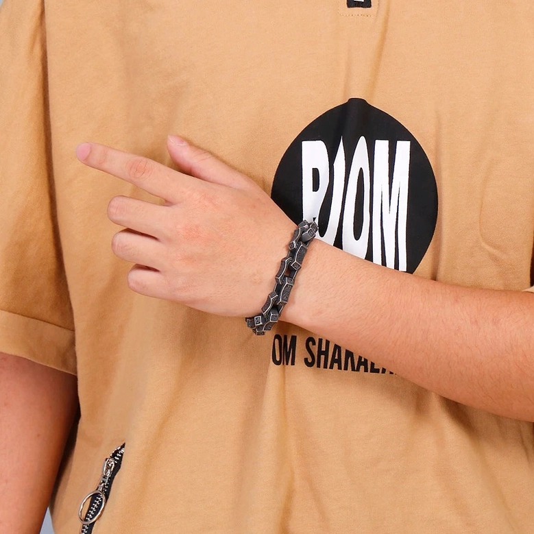 Antique silver tone gothic square link bracelet on male model wrist paired with casual tee