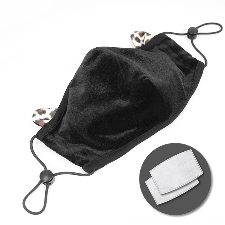 Black gothic face mask with leopard ears and replaceable filter system, flat lay overhead shot