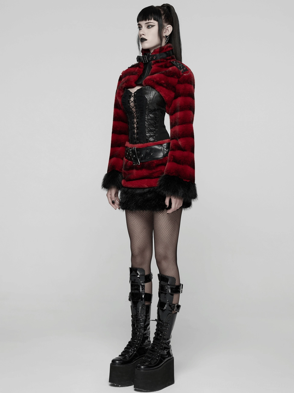 Gothic faux fur mini skirt full product shot on mannequin with studded belt, red and black layered design