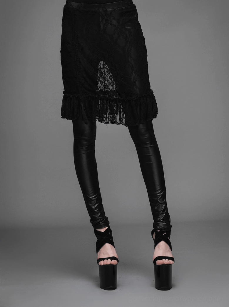Black gothic faux leather leggings with lace skirt, front view with crisscross platform heels against gray background
