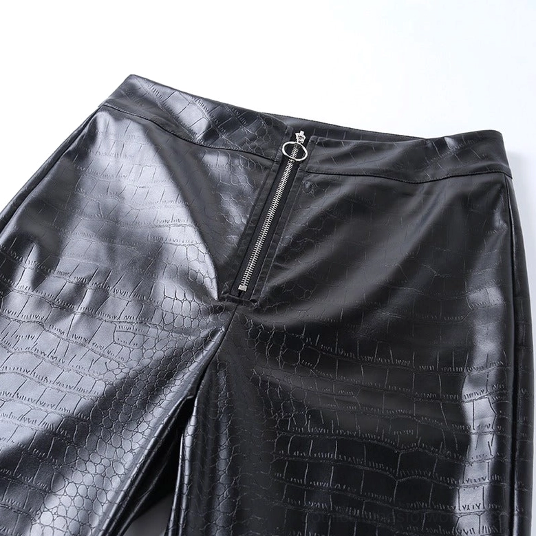 Close-up detail shot of black gothic high-waist faux leather pencil pants, emphasizing the O-ring zipper and premium material quality
