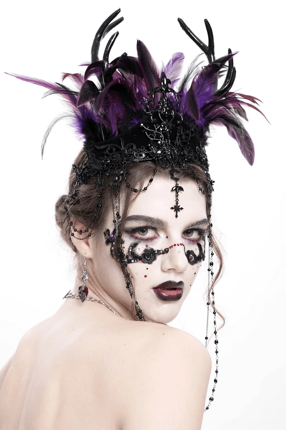 Mannequin display highlighting the intricate design of black-purple feathered gothic crown with chain and cross details