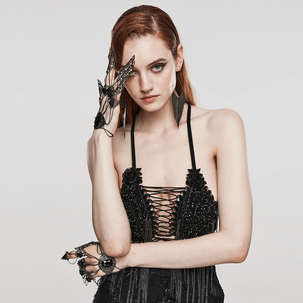 Gothic finger hand chain jewelry worn on both hands of model from front view, showing complete set styling with ornate rose buckles and tassel claw nail details