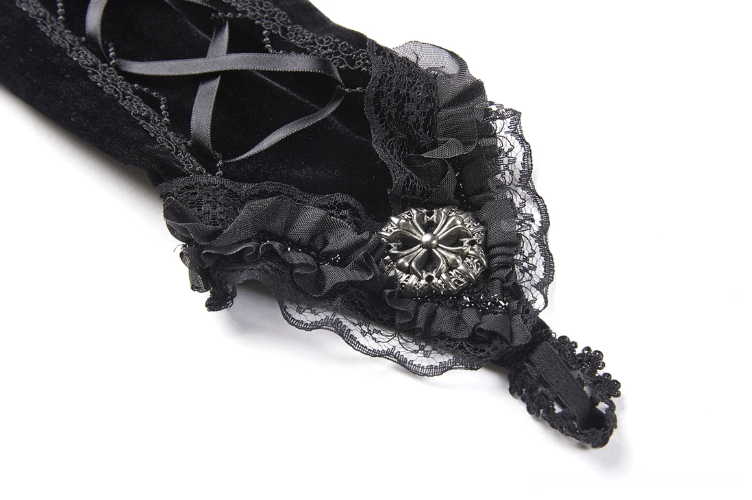 Detailed front view of gothic glove cuff flat lay showing decorative metal brooch, intricate lace trim, and luxurious black velvet fabric
