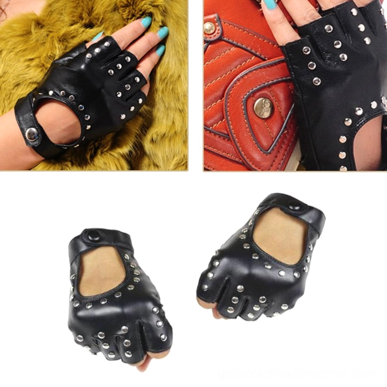 Studded fingerless gloves close-up on hand with teal nail polish against yellow fur background, punk rock gothic style