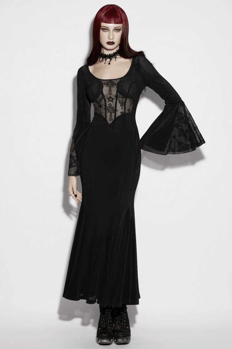 Black gothic fishtail dress hem detail showcasing dramatic flare and mesh construction in close-up