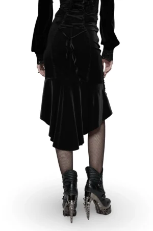 Back view of black gothic fishtail skirt showing lace-up corset closure, rose lace detailing, and asymmetrical velvet hem on female model