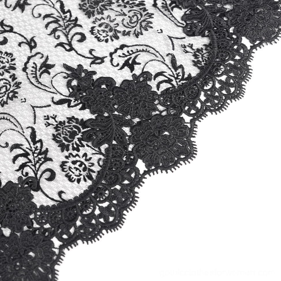 Gothic fishtail skirt detail view emphasizing metal chain drapes and luxurious fabric construction