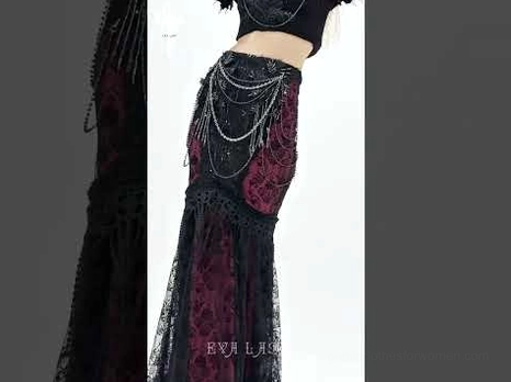 Close-up detail shots of gothic fishtail skirt showing metal chain accents and layered black lace fabric construction