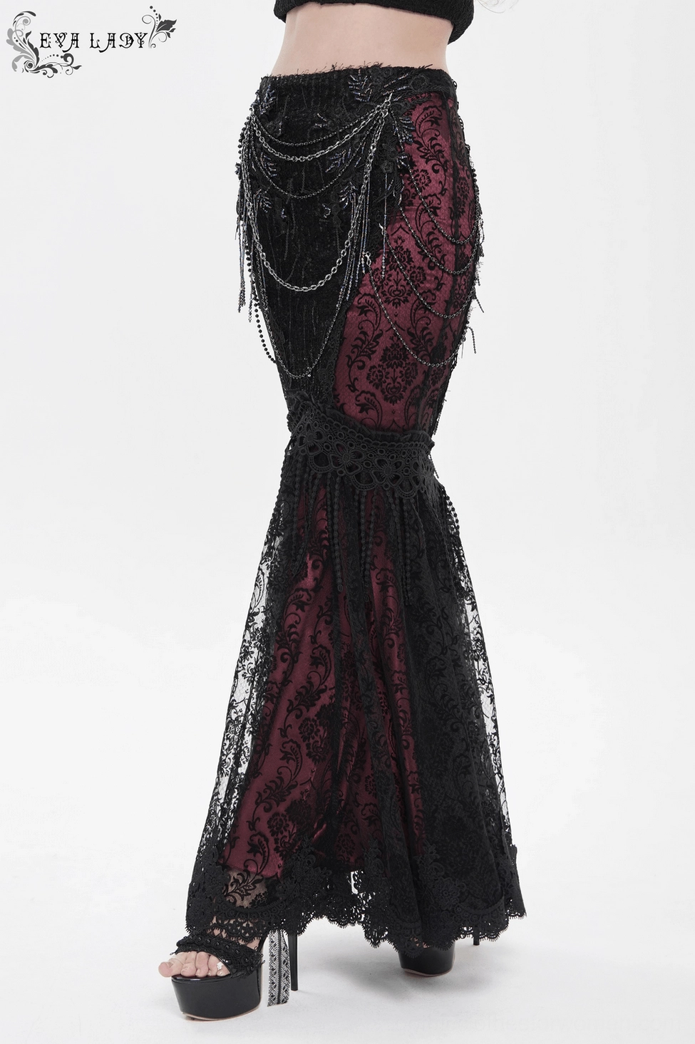 Close-up view of gothic fishtail skirt showing scalloped hem trim and sequined lace layering