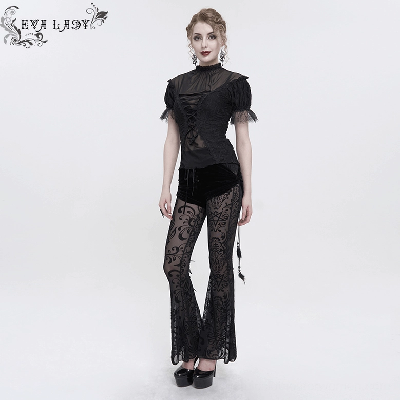 Detailed view showing feather pendant attachment point on black gothic flare pants with lace-up waist design