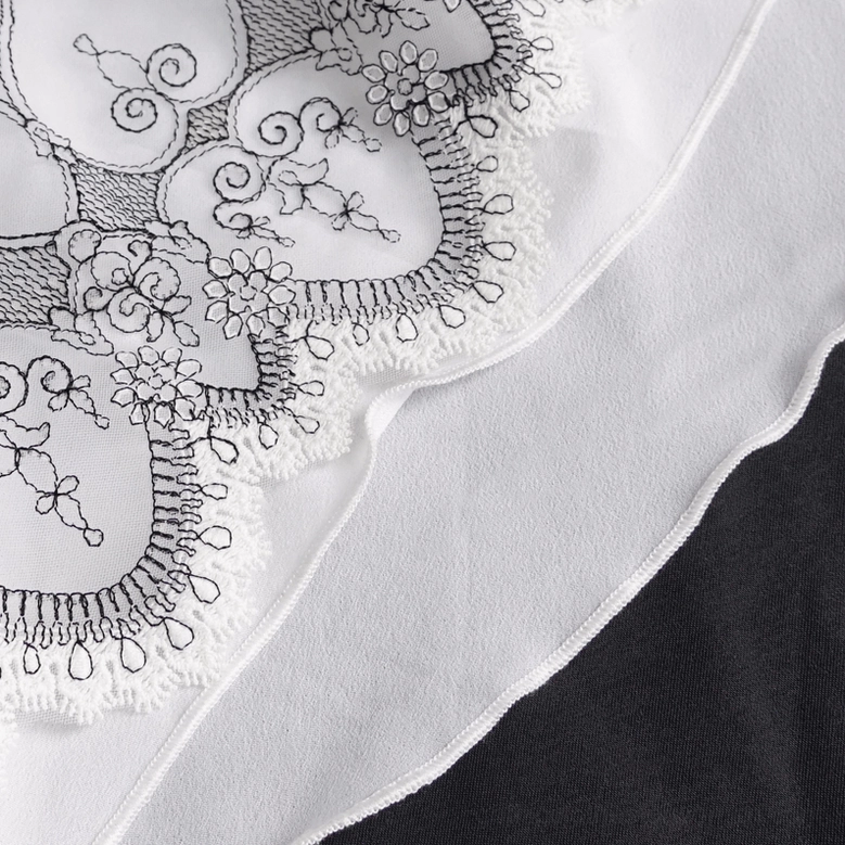 Gothic floral jabot neckwear alternative angle showing ruffled layers and black embroidery on white base
