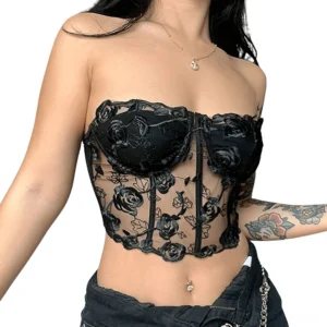 Black strapless floral lace corset crop top with 3D rose embroidery, worn by tattooed model, front close-up view showcasing sheer mesh and underwire cup details