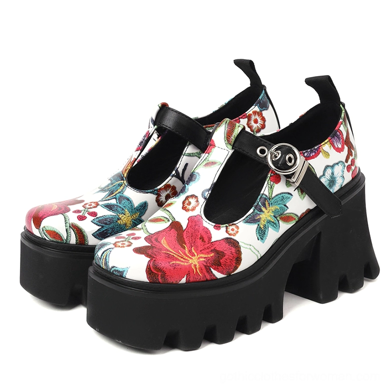 Pair of red and black floral gothic platform Mary Jane pumps with metal T-strap buckle and chunky lug sole