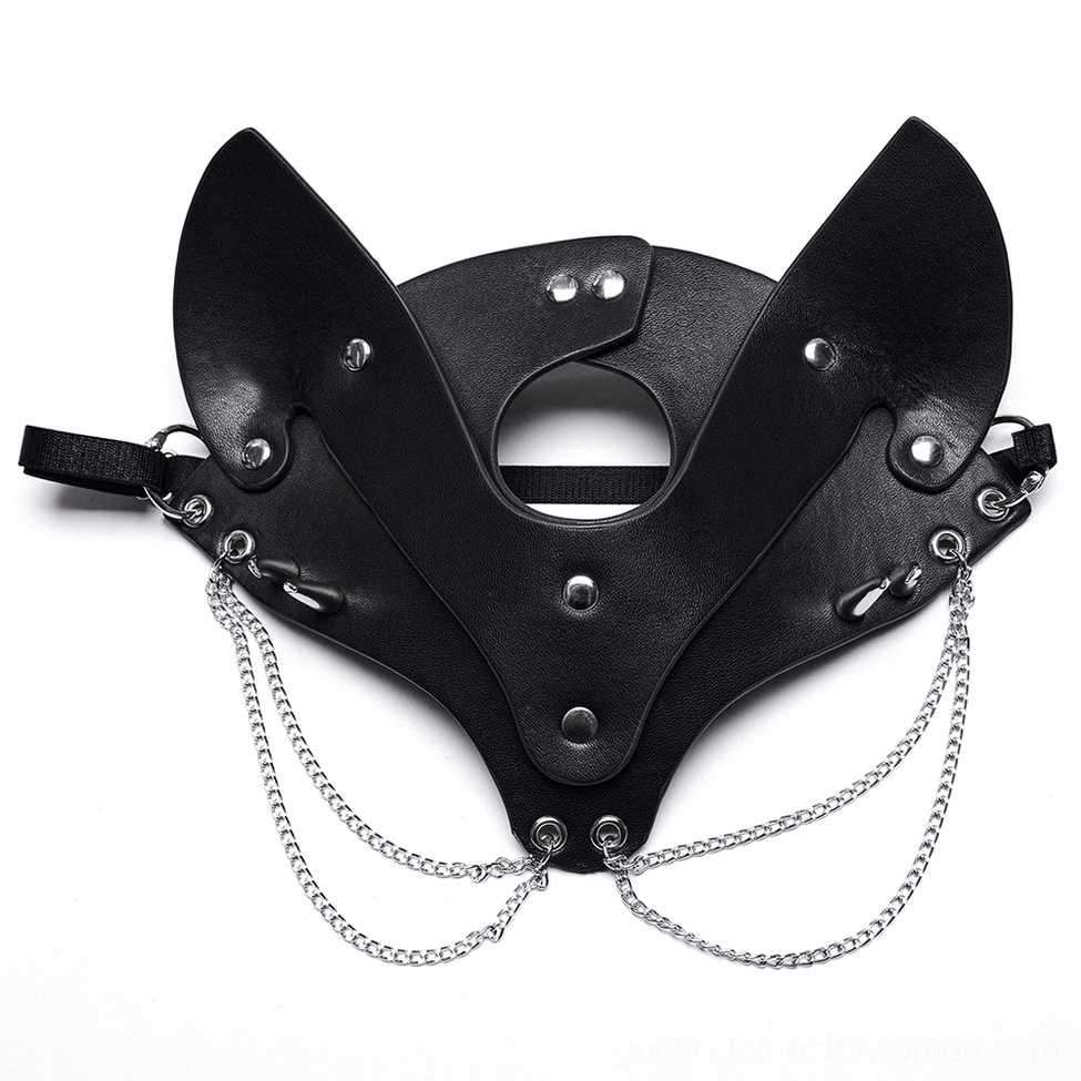 Flat lay of black faux leather fox mask with adjustable elastic strap and hanging silver chains, showing metal studs detail