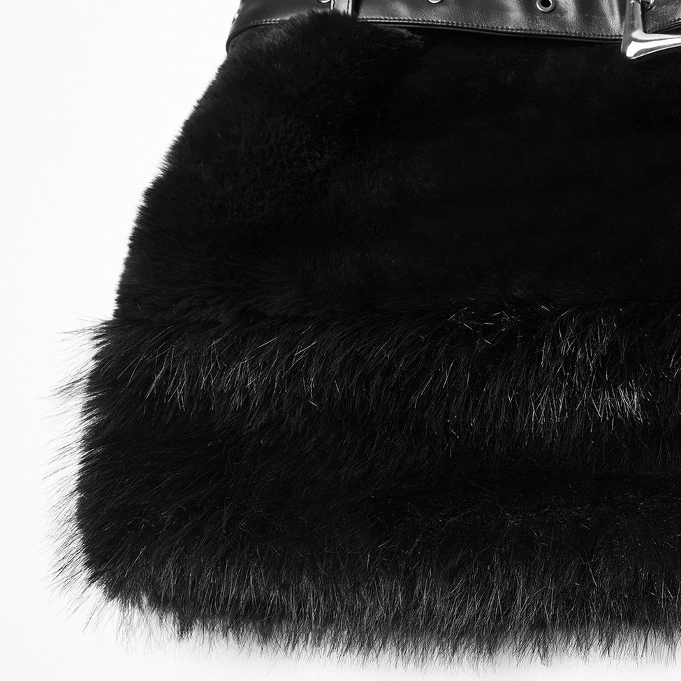 Macro close-up of black faux fur hem showing long fluffy fur texture and luxurious artificial material quality
