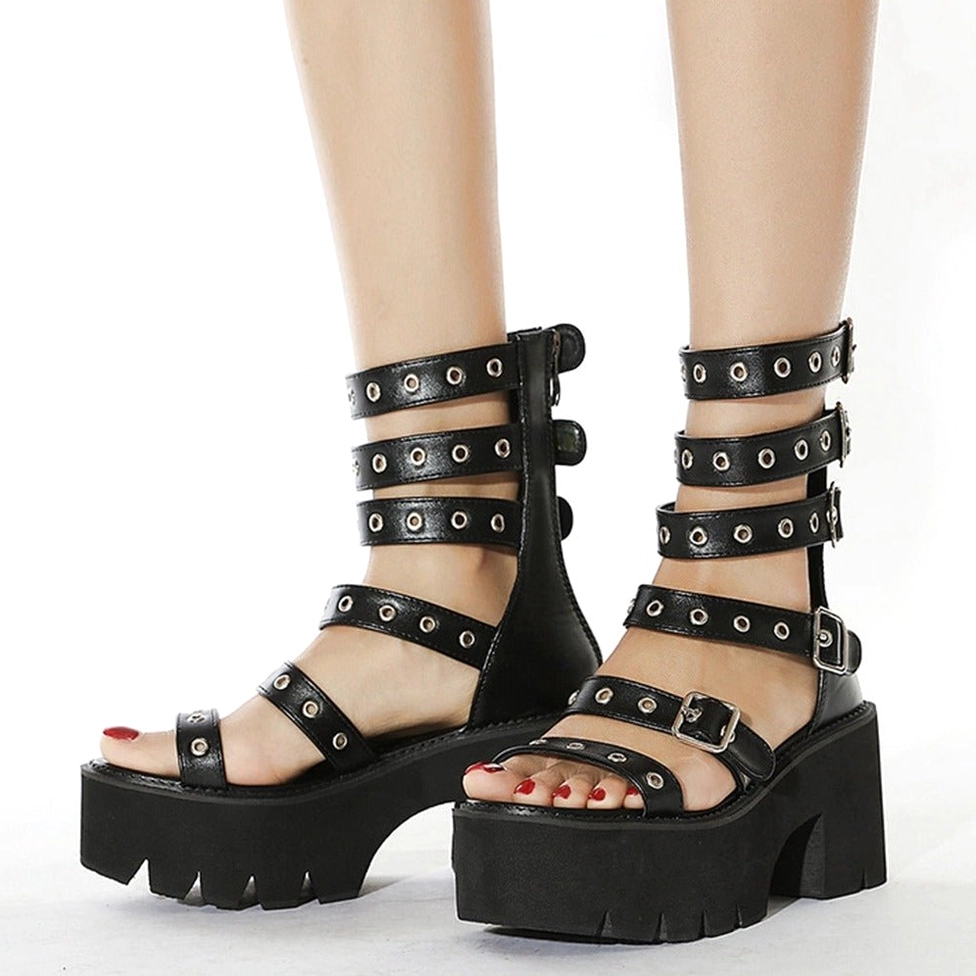 Front view of open toe gothic gladiator sandals with red nail polish, showcasing toe strap buckle and tall ankle support straps