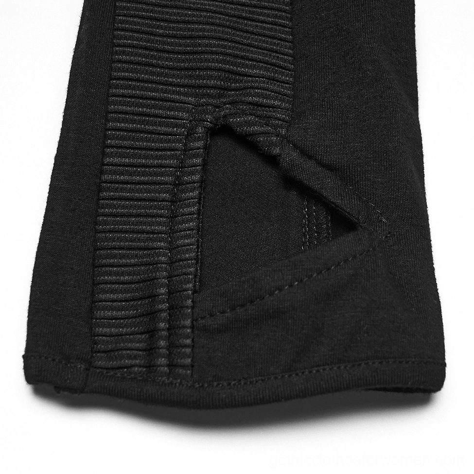 Macro close-up of gothic glove finger cutout showing black ribbed fabric trim and structural design precision
