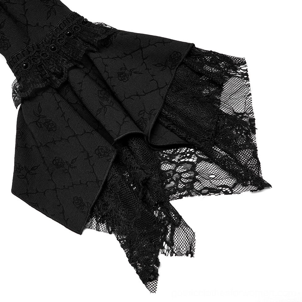 Black gothic gown bell sleeve close-up - fishnet lace ruffle trim and rose embroidered fabric