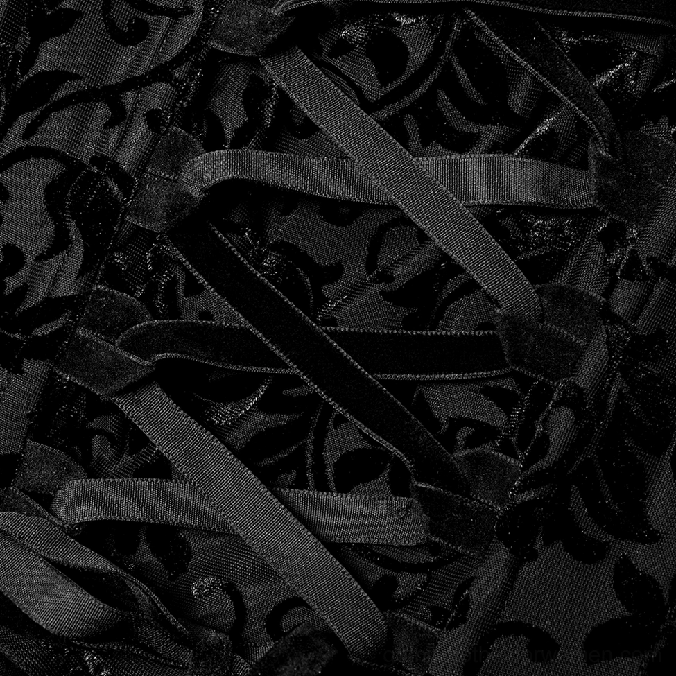 Flat lay close-up of gown corset lacing back with damask velvet and satin trim detail