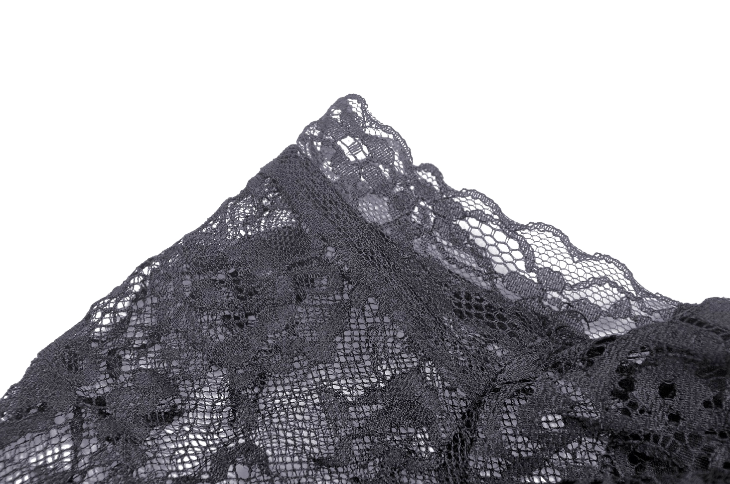 Texture close-up of delicate black floral ruffled lace fabric used in gothic gown