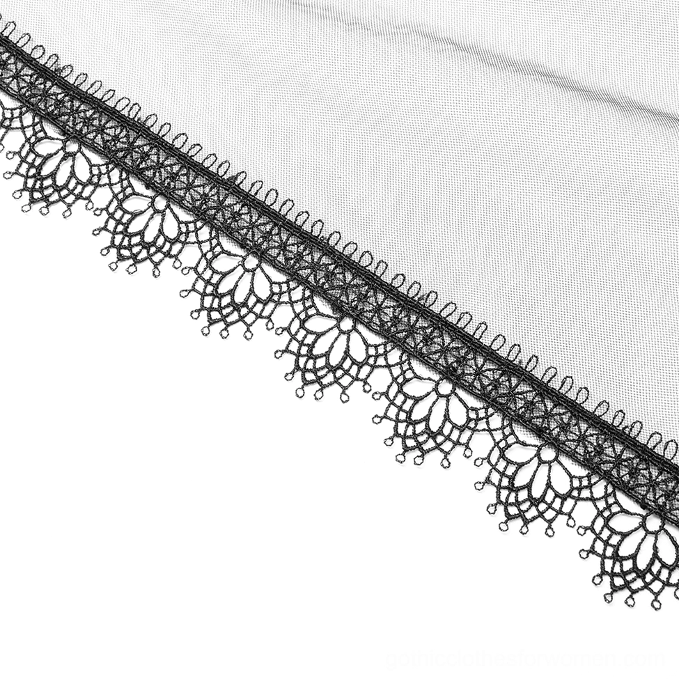 Macro shot of filigree crochet lace tulle hem trim on gothic evening gown
