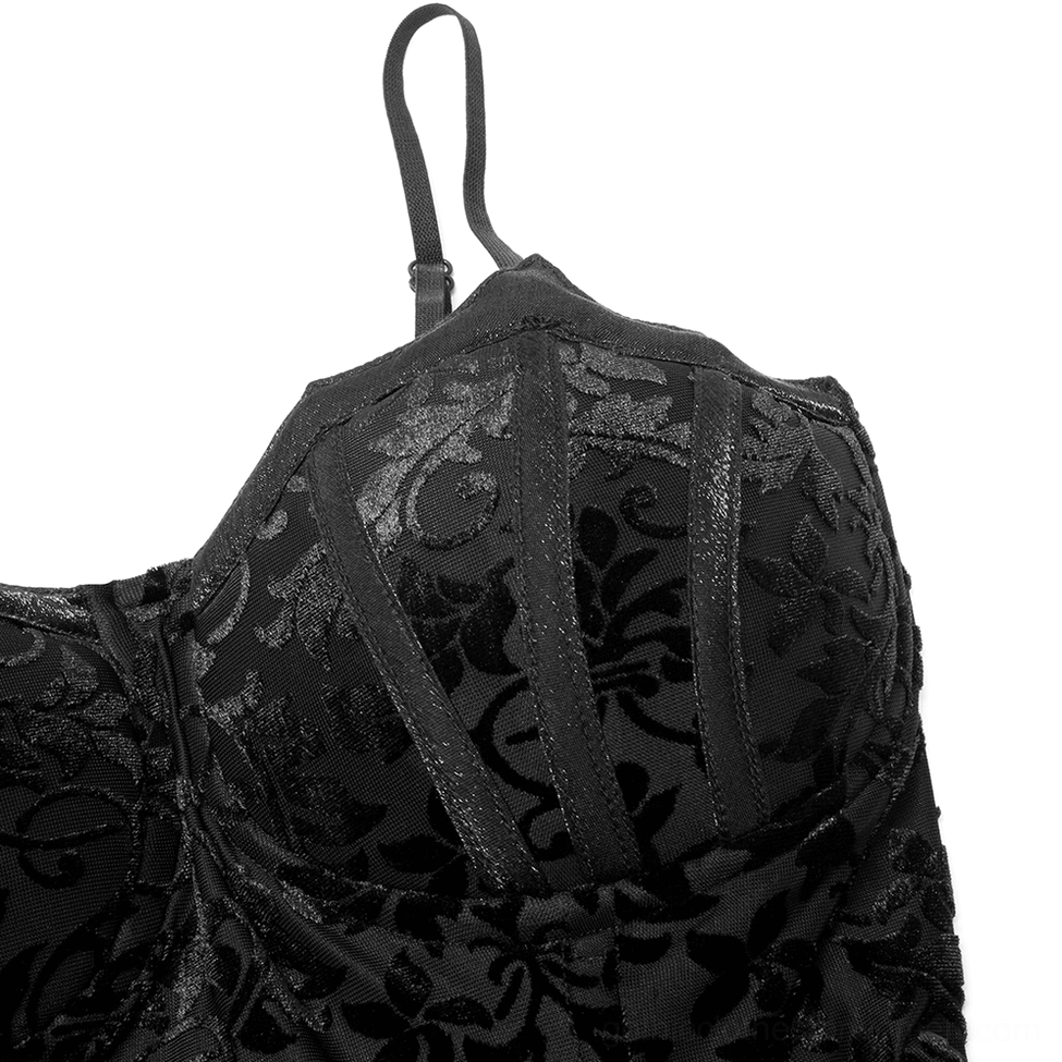Close-up detail of adjustable spaghetti strap and velvet floral pattern on gown bodice