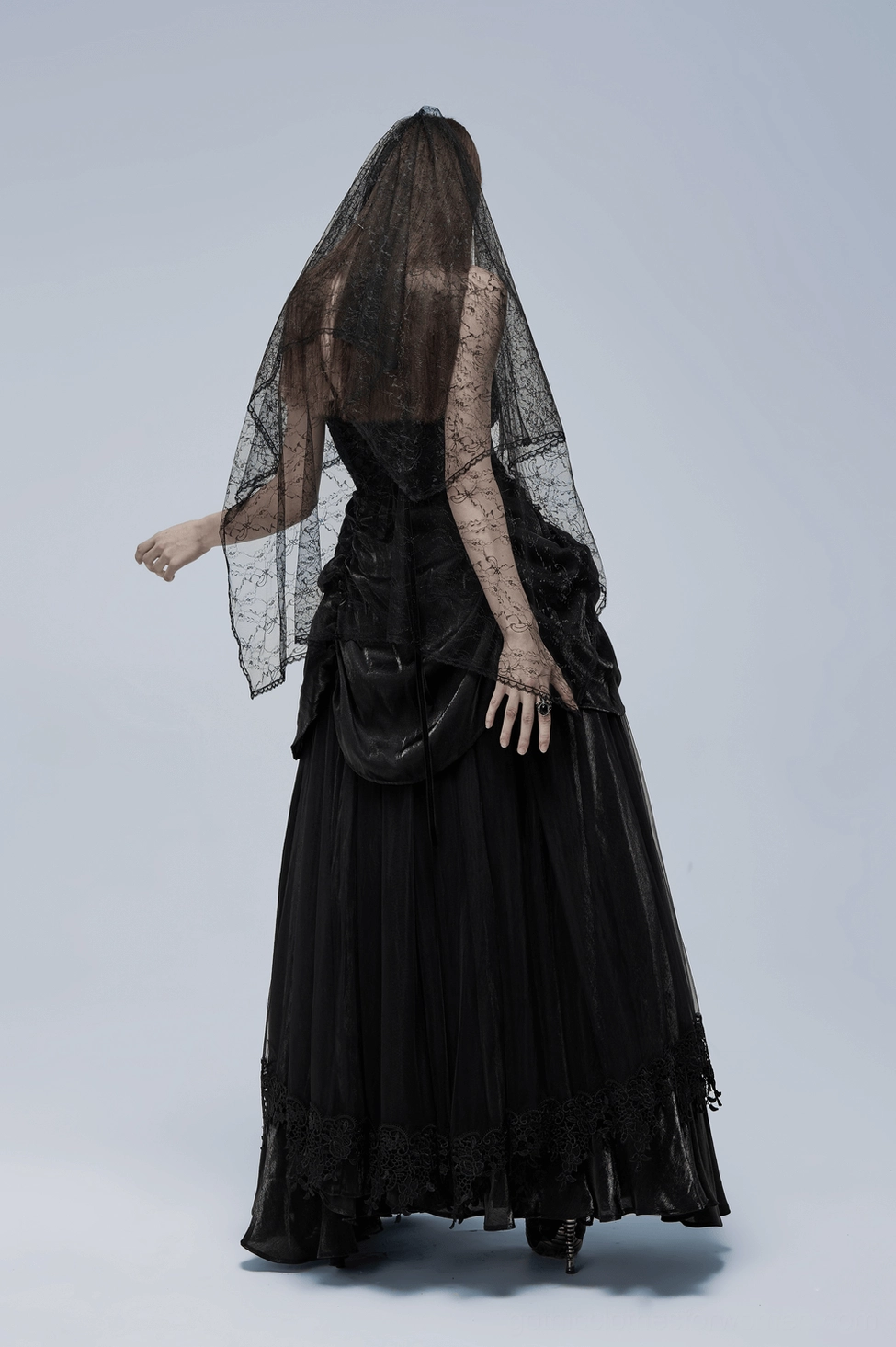Close-up detail of gothic gown's velvet bodice texture and craftsmanship