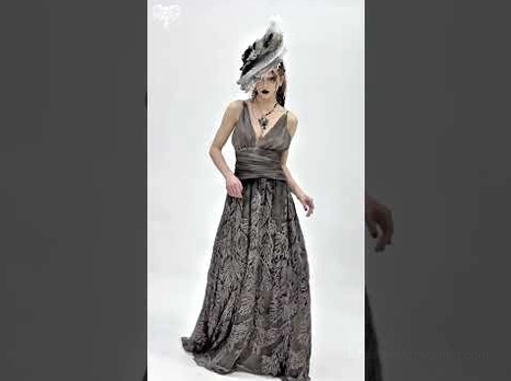 Gothic evening maxi dress with vintage hat styled photoshoot showing full-length leaf print skirt