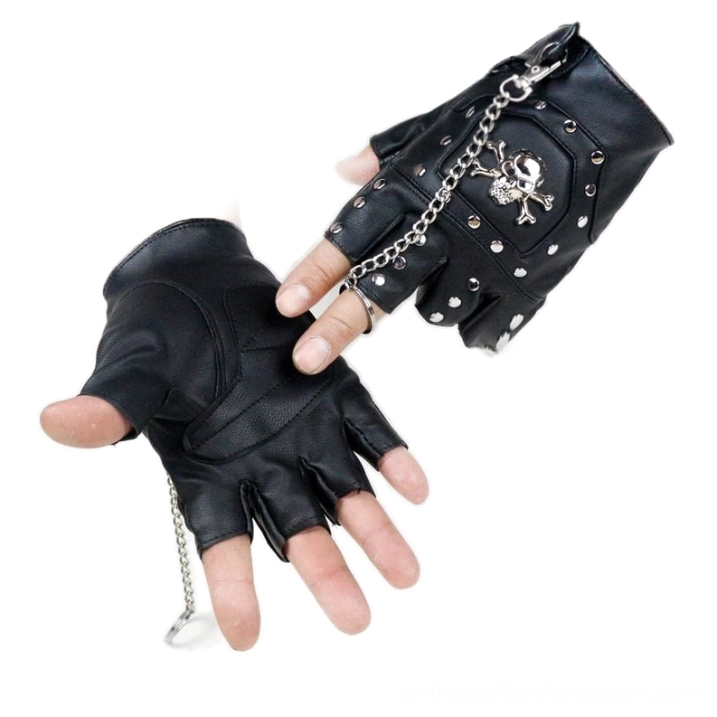 Two hands wearing black skull half-finger gloves with chain pendant and silver rivets - front close-up detail shot