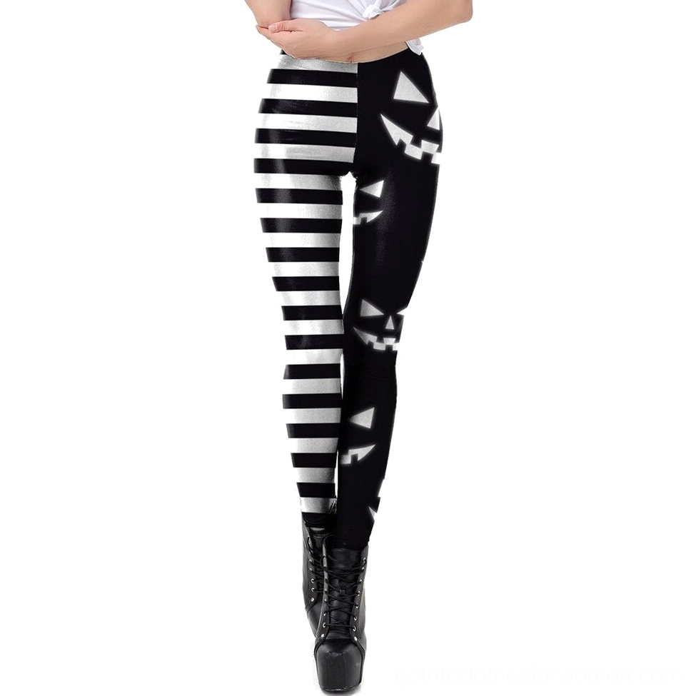 Women's gothic Halloween leggings with asymmetrical print design, front view showing pumpkin and stripe pattern detail