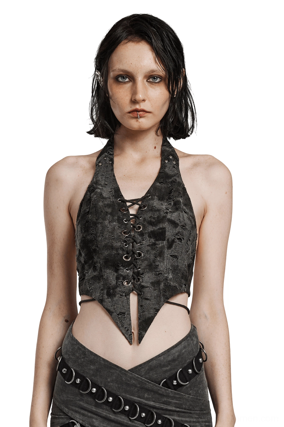 Dark gothic lace-up backless halter crop top with pointed hem on model, front view showcasing distressed knit fabric and metal eyelet lace-up details