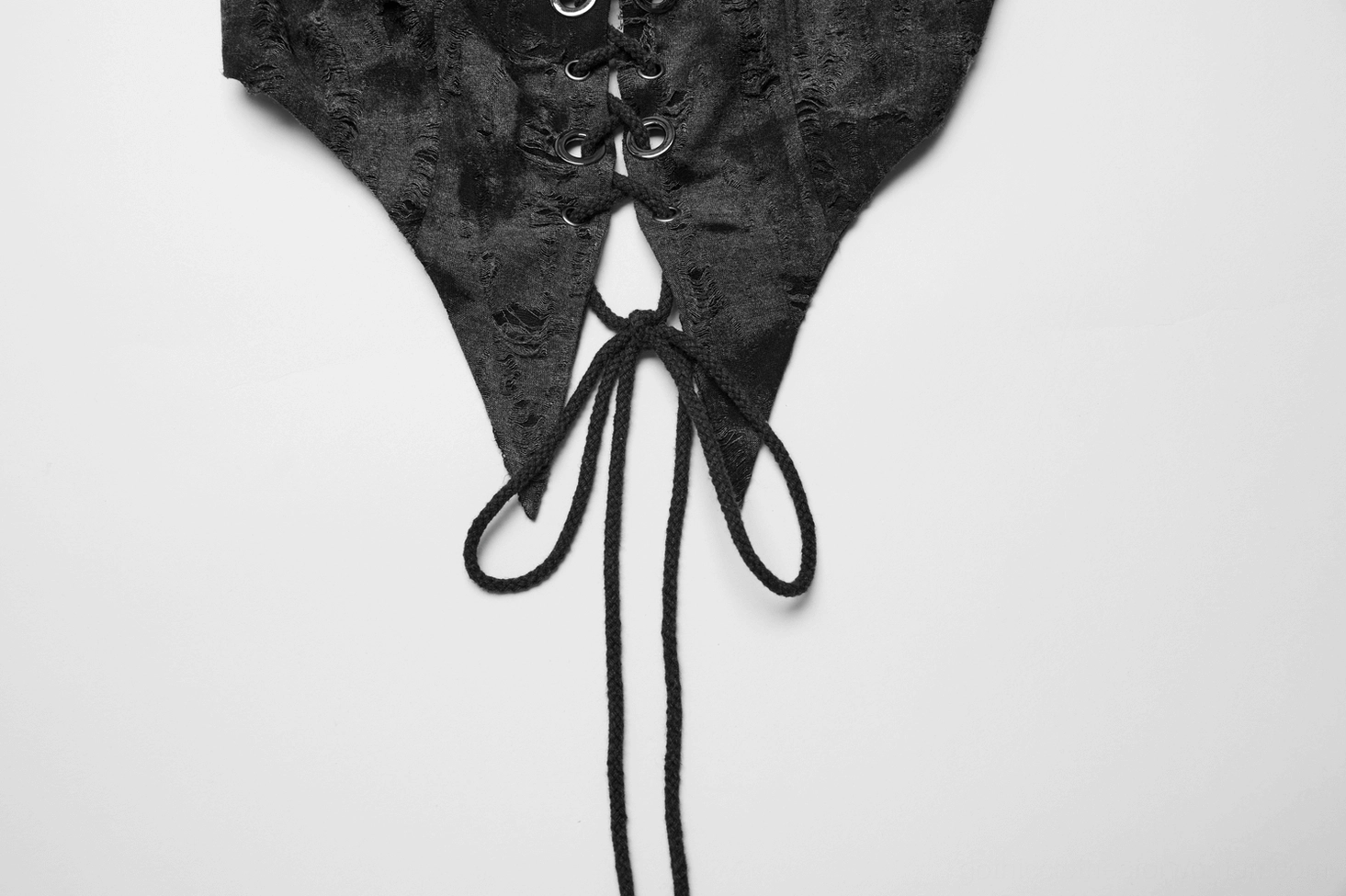 Gothic crop top paired with matching mini skirt ensemble showing lace-up front design and dark distressed fabric on model