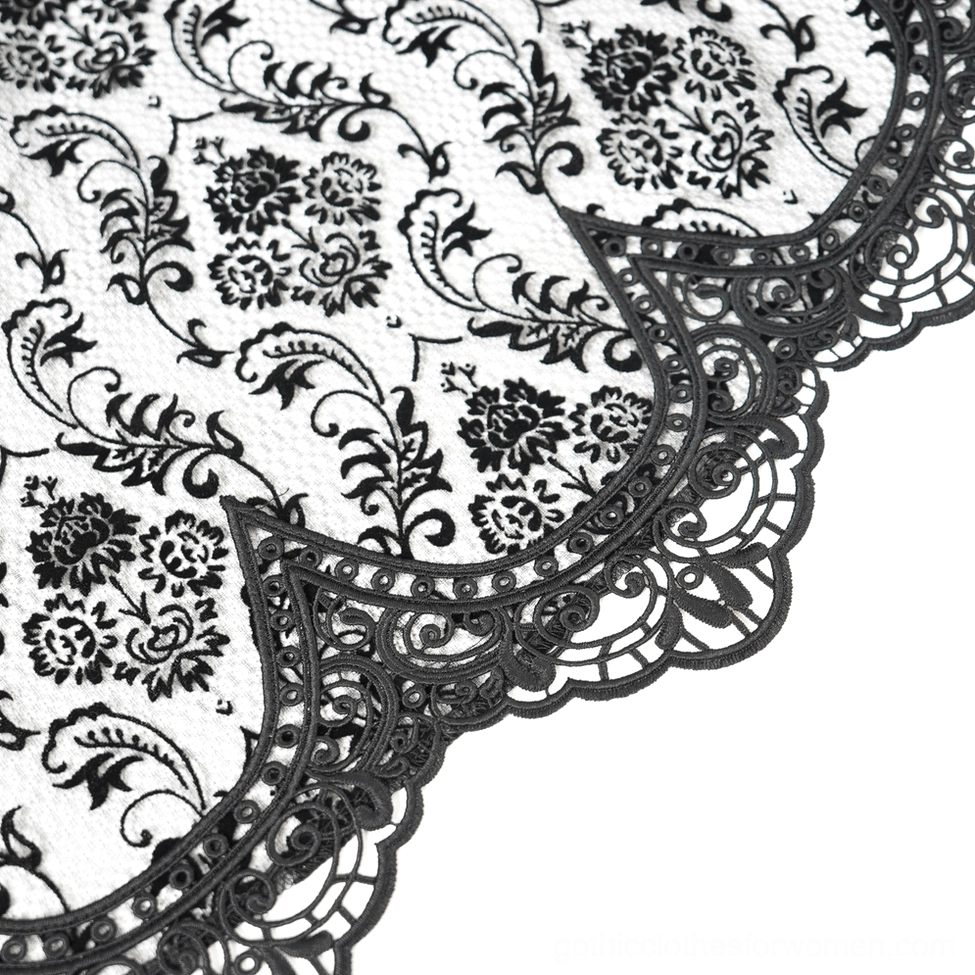 Gothic halter dress detail showing beaded chain neckpiece and corset bodice structure