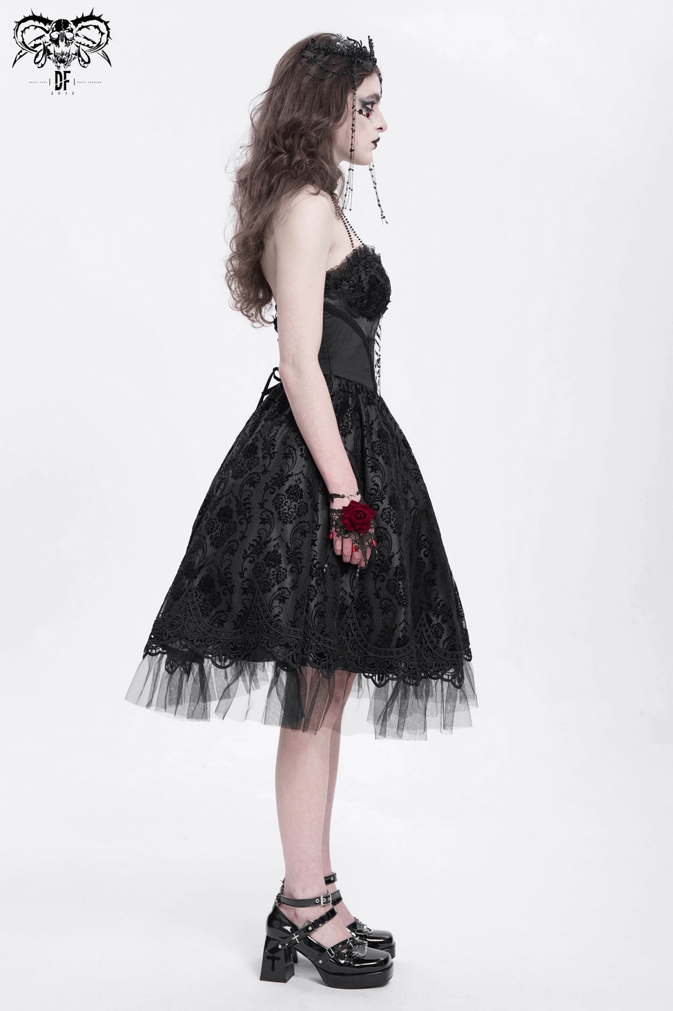Gothic halter dress on display showing complete ensemble with beaded neckpiece and multi-layered tulle