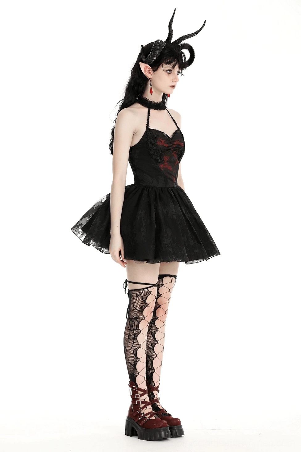 Black gothic halter dress highlighting lace-up back closure, red graphic print, and full ruffled tulle skirt - editorial styling