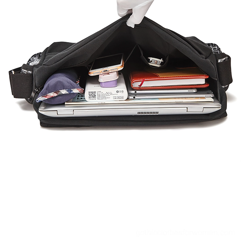 Interior view of black gothic handbag showing spacious storage, laptop and stationery compartment with polyester lining