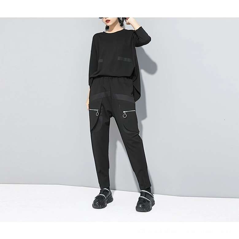 Complete black gothic outfit featuring coordinated harem cargo pants and matching top on full female model