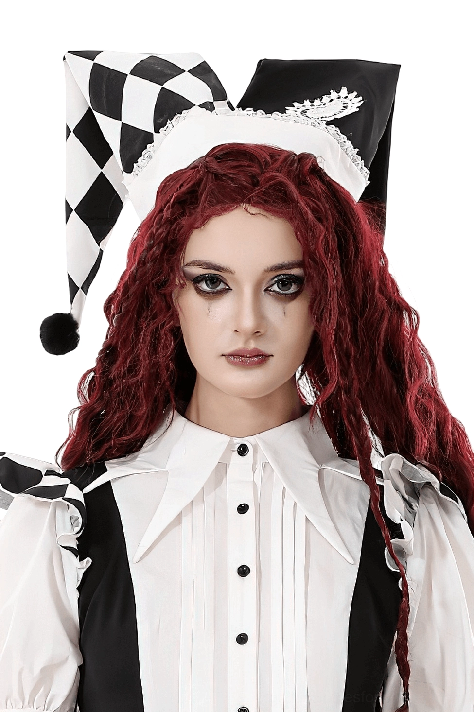 Black and white harlequin jester hat with lace heart embroidery worn by model with red curly hair, front studio view