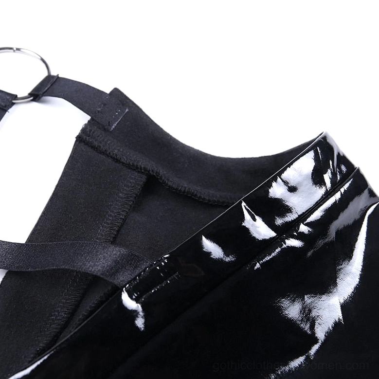 Overhead view of black patent leather crop cami displaying harness construction and O-ring placement