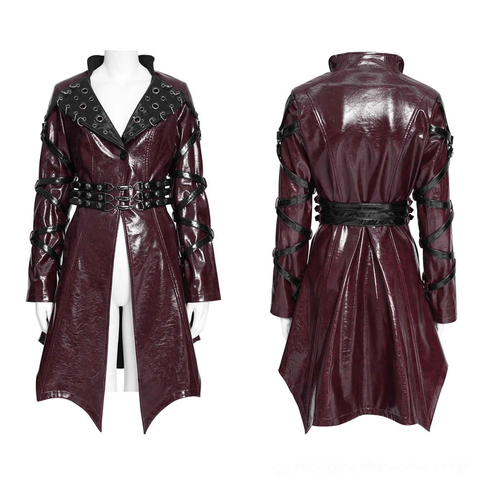 Gothic burgundy patent leather harness coat with metal grommet-trimmed lapels and buckle waist belt displayed on mannequin, front and back view