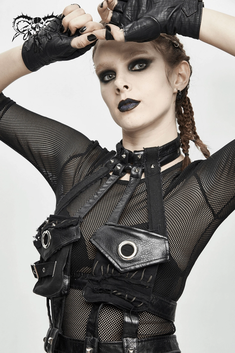 Black faux leather gothic bondage harness worn by model low front angle view with fingerless leather gloves styling