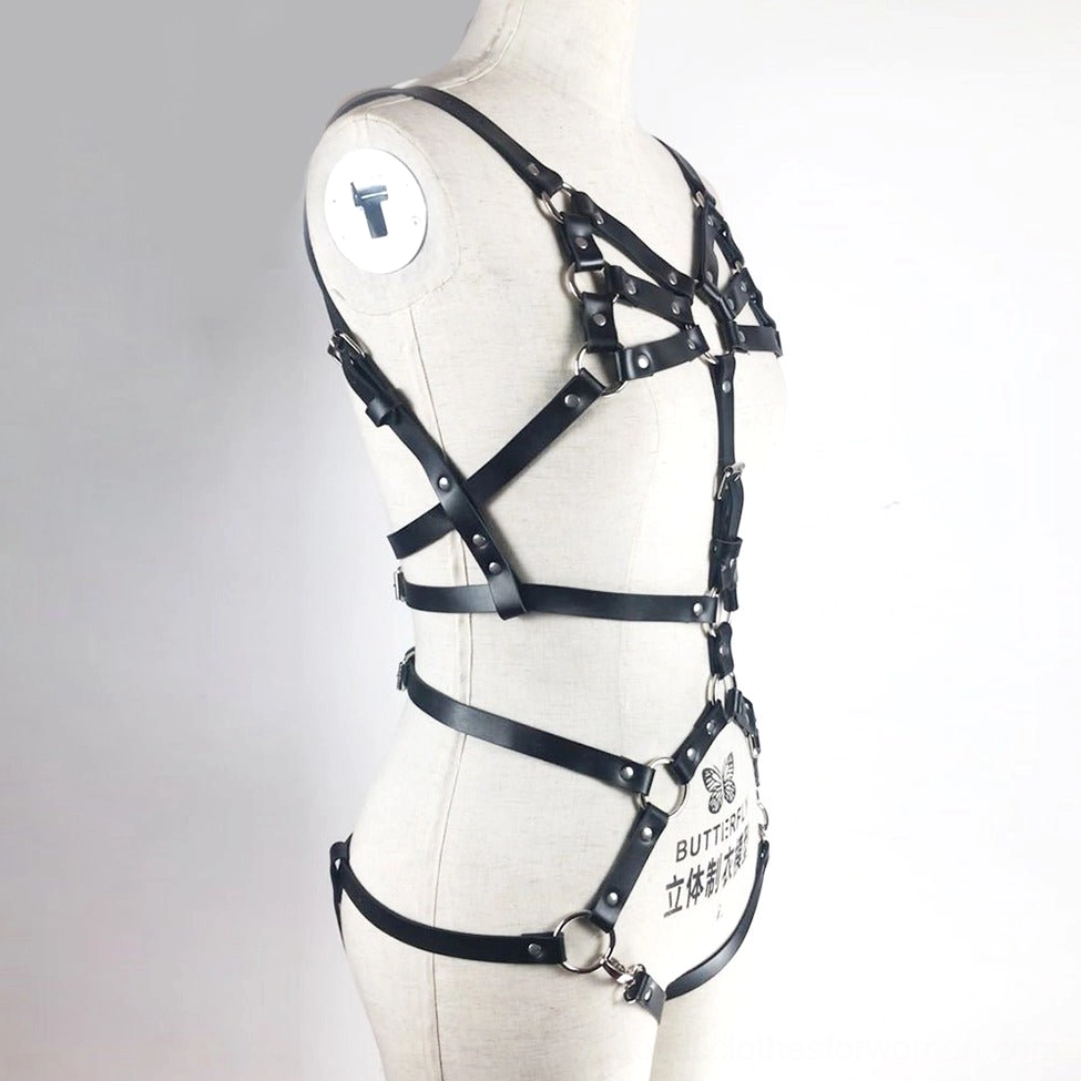 Gothic body harness set on display mannequin, side view highlighting black leather straps and metal buckles