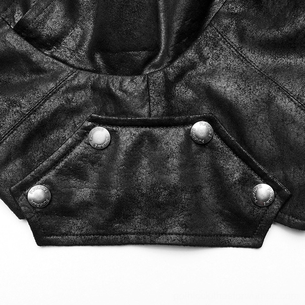 Top-down close-up of black faux leather gothic harness shoulder panel showing round metal rivet buttons and folded design