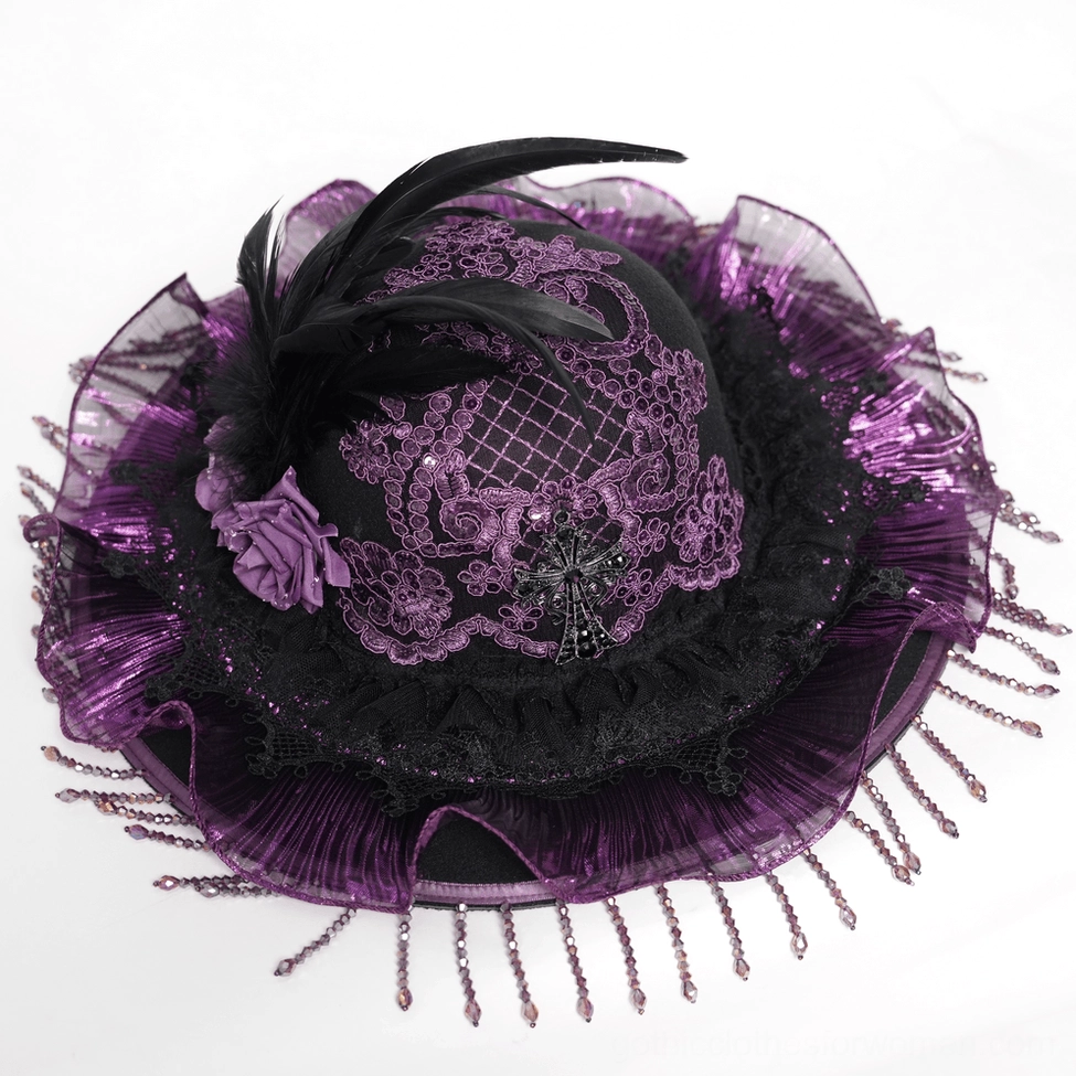 Gothic hat close-up top-down view showing intricate lace cross and beaded fringe details