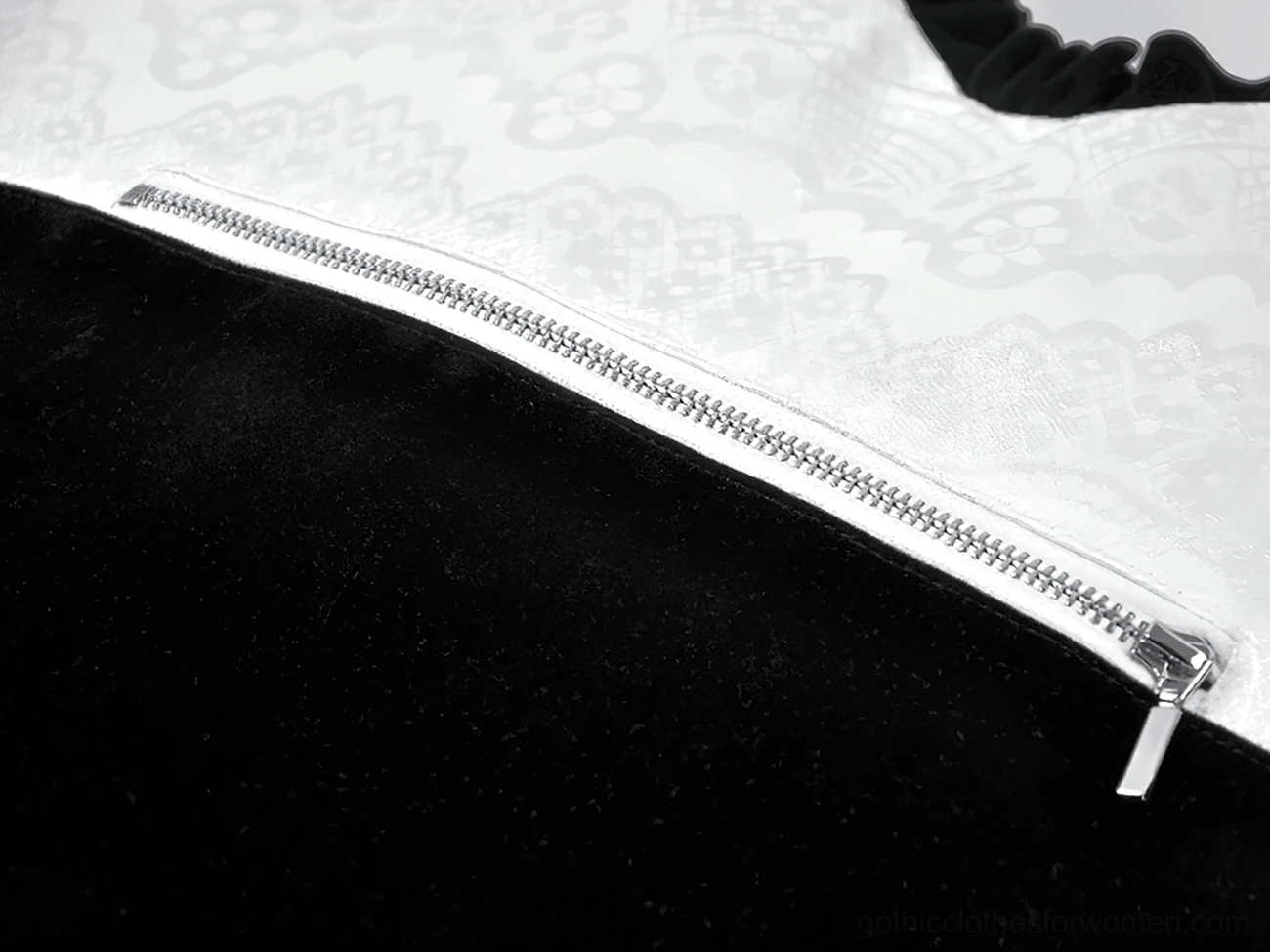 Heart-shaped gothic lace bow bag interior view showing secure zipper closure and spacious compartment for essentials