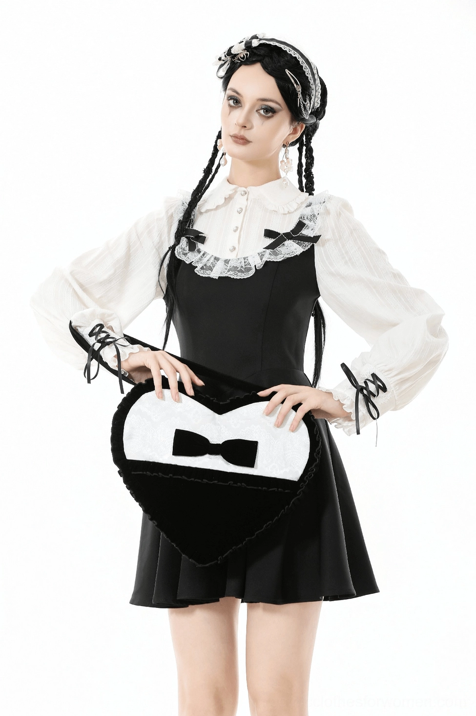 Black heart-shaped gothic lace bow crossbody bag three-quarter view highlighting dimensional bow centerpiece and overall silhouette